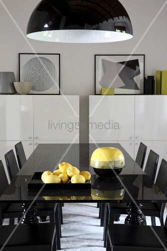 Yellow Accents In Black Dining Area Buy Image