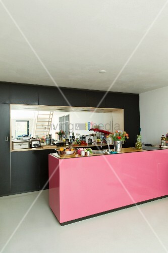 Pink Kitchen Island In Front Of Black Image 11351263 Pink Kitchen Island In Front Of Black Ed Cupboards With Mirrored Niche