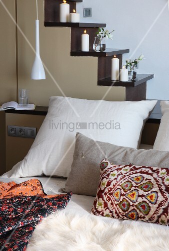 Various Pillows On Bed In Front Of Buy Image 11364265