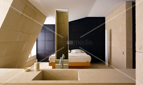Stone Wash Basin In A Bedroom With A Bed Buy Image