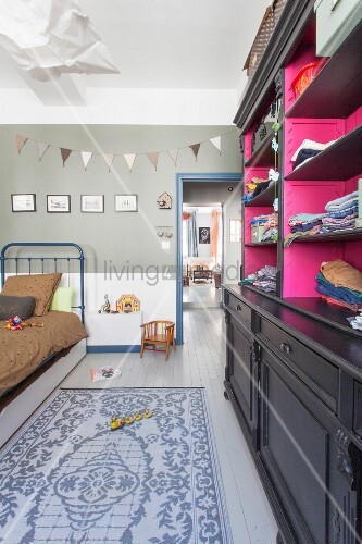 Bed Metal Toys And Black Vintage Bild Kaufen 12242071 Bed Metal Toys And Black Vintage Cabinet With Hot Pink Interior In Child S Bedroom