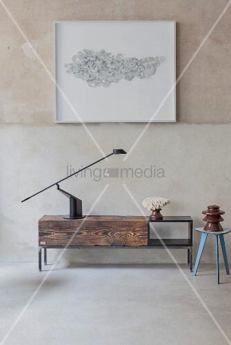Black Table Lamp On Simple Low Sideboard Made From Reclaimed Wood Black Table Lamp On Simple Low Sideboard Made From Reclaimed Wood Below Framed Artwork