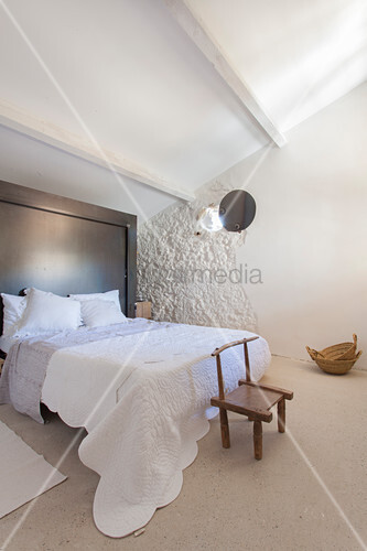 Small Wooden Chair At Foot Of Bed In Image 12274137 Small Wooden Chair At Foot Of Bed In
