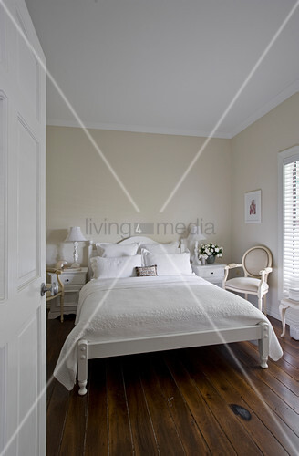 White Double Bed With White Bedspread In Buy Image