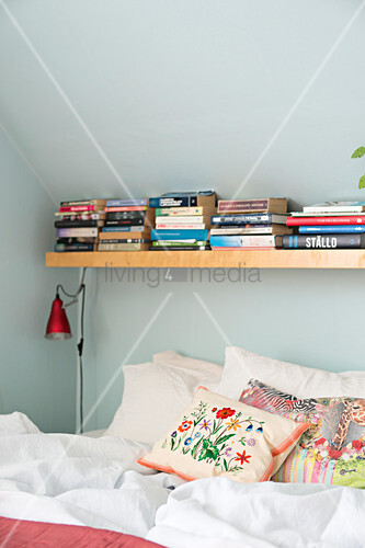 Books On Shelf Above Bed Under Sloping Buy Image