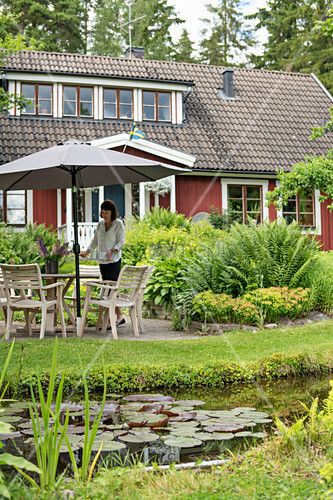 Pond And Terrace Outside Swedish House Buy Image 12315617