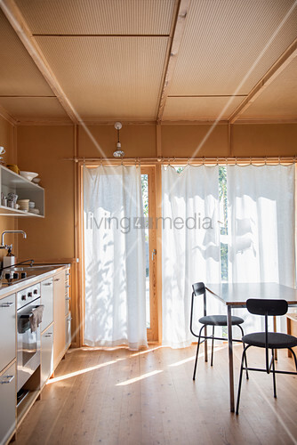 Wood Clad Kitchen With White Curtains On Buy Image 12434971