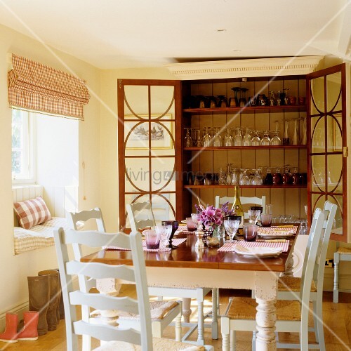 A Dining Table Laid In Front Of An Open Buy Image 00706407